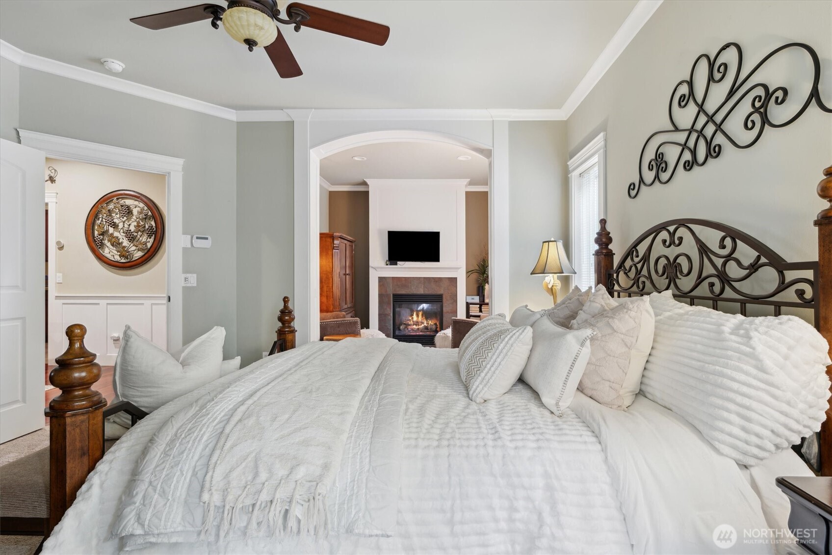 26713 178th Loop Southeast Covington, WA 98042 - Photo 11 of 30 a bedroom with a bed and a chandelier