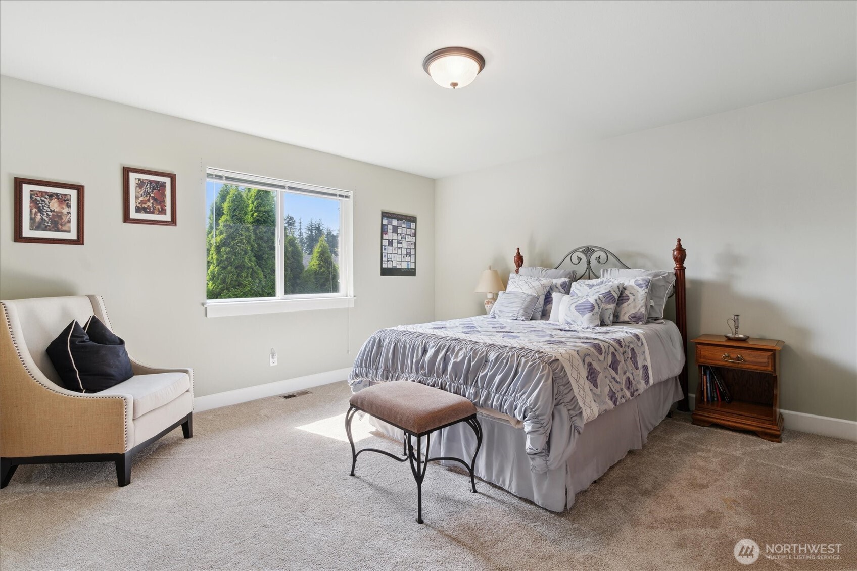 26713 178th Loop Southeast Covington, WA 98042 - Photo 17 of 30 a spacious bedroom with a bed and a couch
