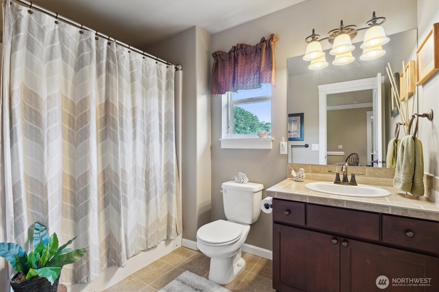 26713 178th Loop Southeast Covington, WA 98042 - Photo 20 of 30 a bathroom with a toilet a sink and a mirror