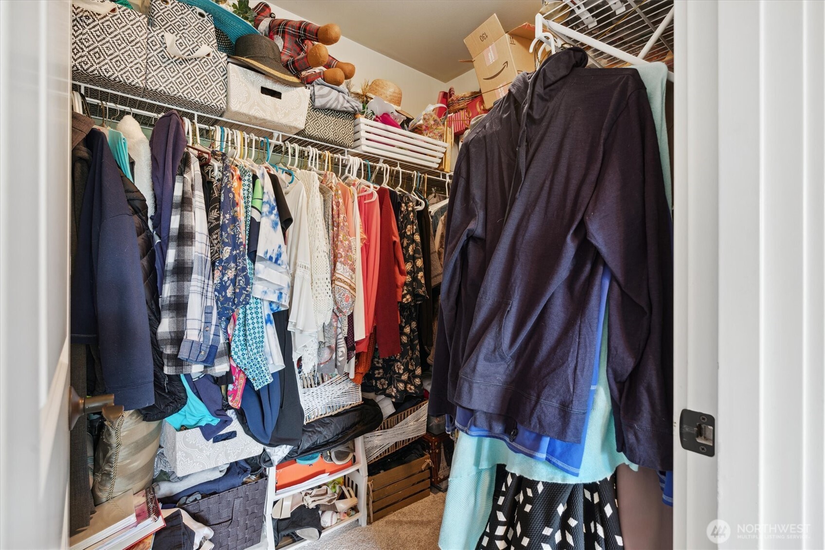 26713 178th Loop Southeast Covington, WA 98042 - Photo 22 of 30 a view of walk in closet with clothes