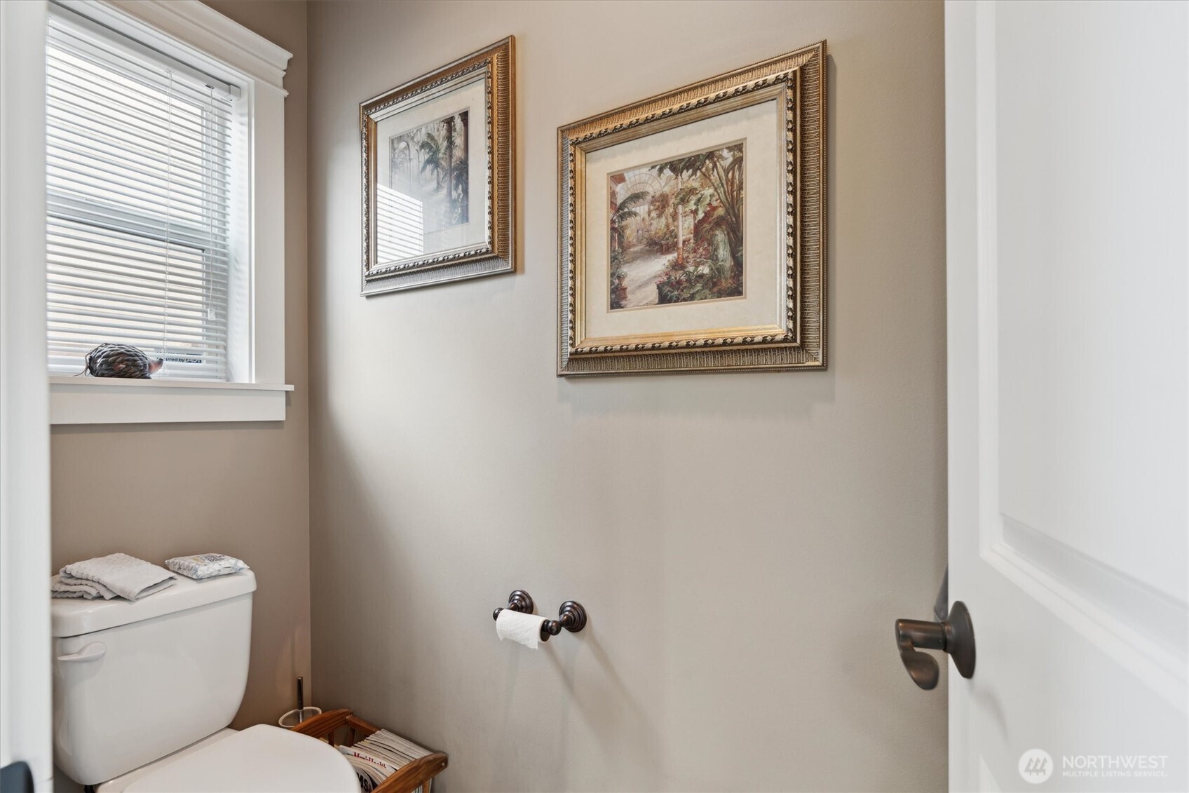26713 178th Loop Southeast Covington, WA 98042 - Photo 23 of 30 a white toilet sitting next to a bathroom sink