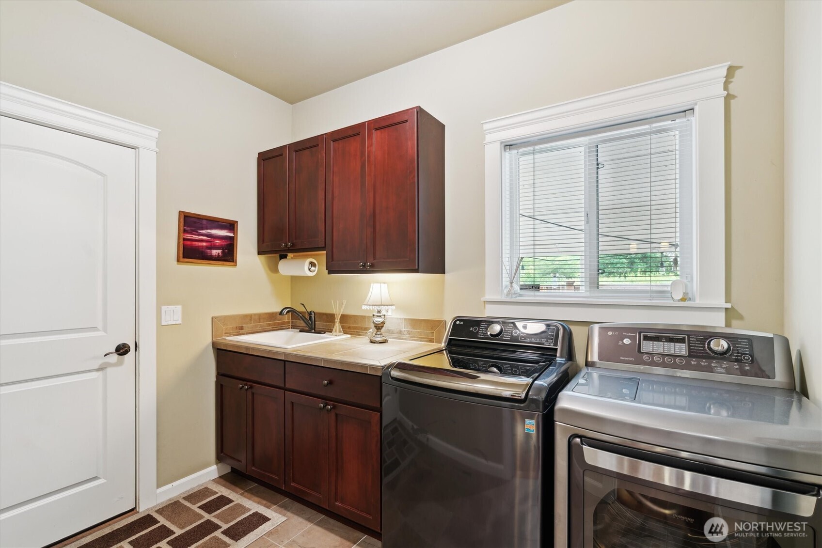 26713 178th Loop Southeast Covington, WA 98042 - Photo 24 of 30 a kitchen with a sink stove and window