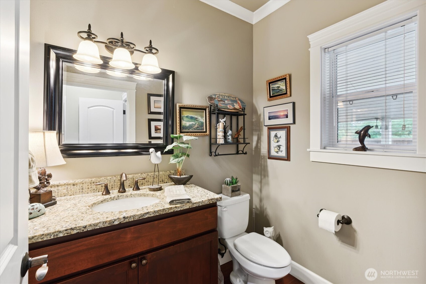 26713 178th Loop Southeast Covington, WA 98042 - Photo 25 of 30 a bathroom with a granite countertop sink vanity mirror and toilet