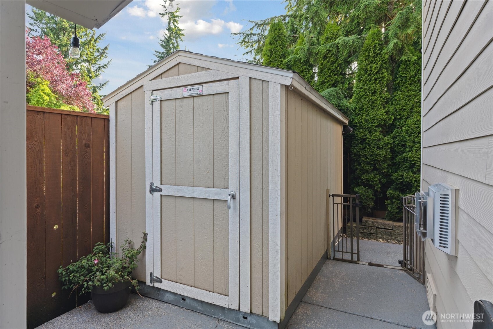 26713 178th Loop Southeast Covington, WA 98042 - Photo 27 of 30 a view of a small house with yard and sitting area