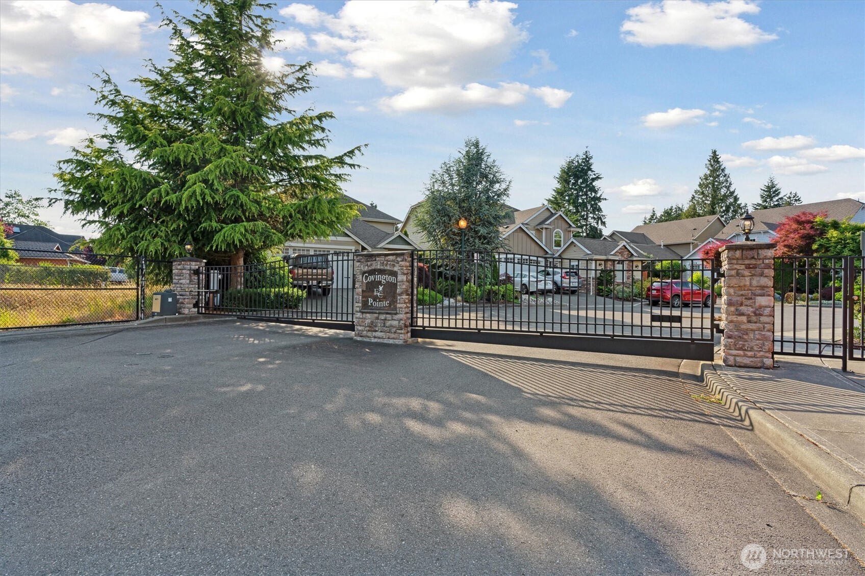26713 178th Loop Southeast Covington, WA 98042 - Photo 3 of 30 a view of a street with houses in the background