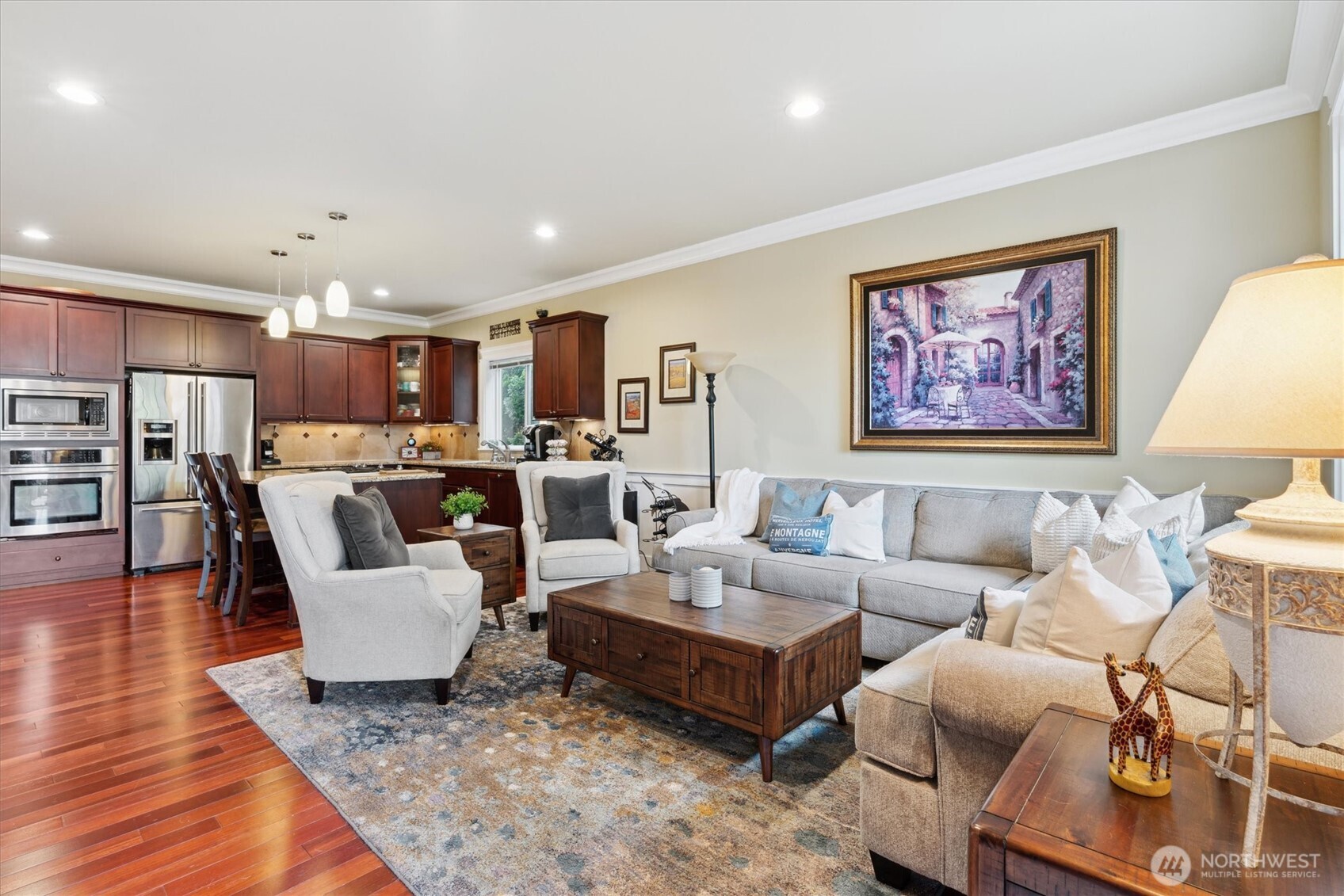 26713 178th Loop Southeast Covington, WA 98042 - Photo 5 of 30 a living room with furniture and kitchen view