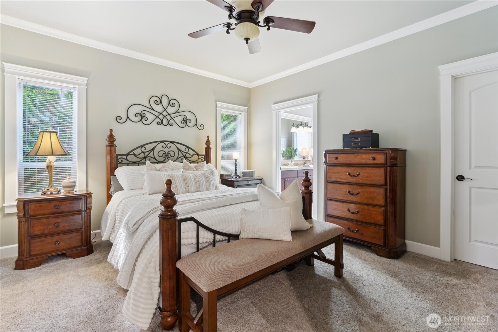26713 178th Loop Southeast Covington, WA 98042 - Photo 10 of 30 a bedroom with a bed and a chandelier