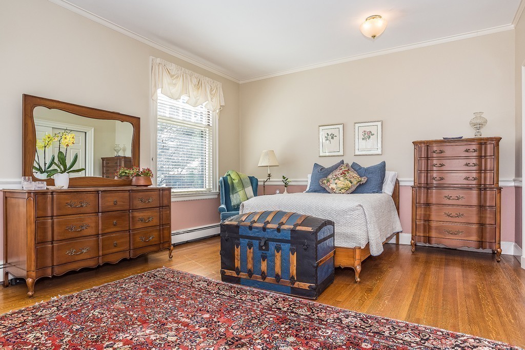100 Pond Street, Unit 6 Boston, MA 02130 - Photo 11 of 29 a bedroom with a bed and a dresser