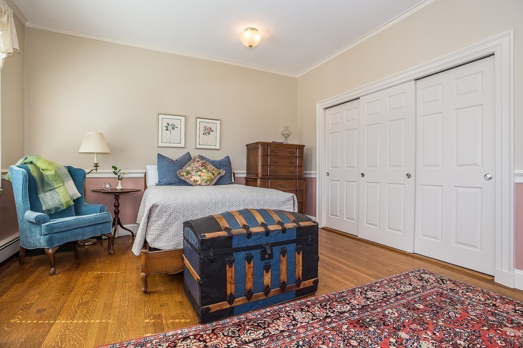 100 Pond Street, Unit 6 Boston, MA 02130 - Photo 14 of 29 a bedroom with a bed and a couch
