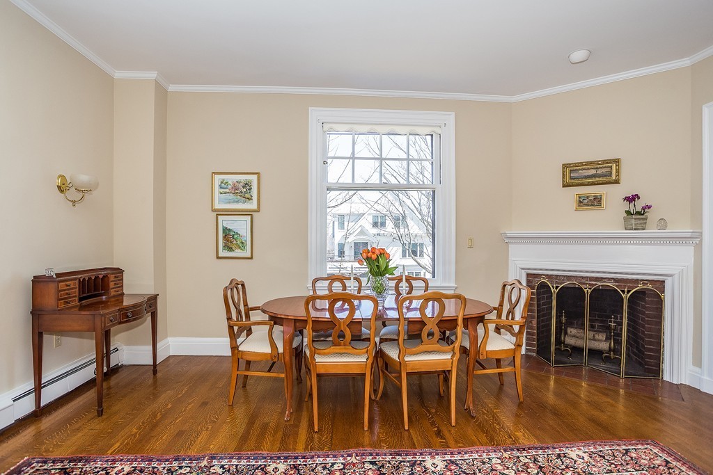 100 Pond Street, Unit 6 Boston, MA 02130 - Photo 24 of 29 a dining room with furniture a fireplace and wooden floor