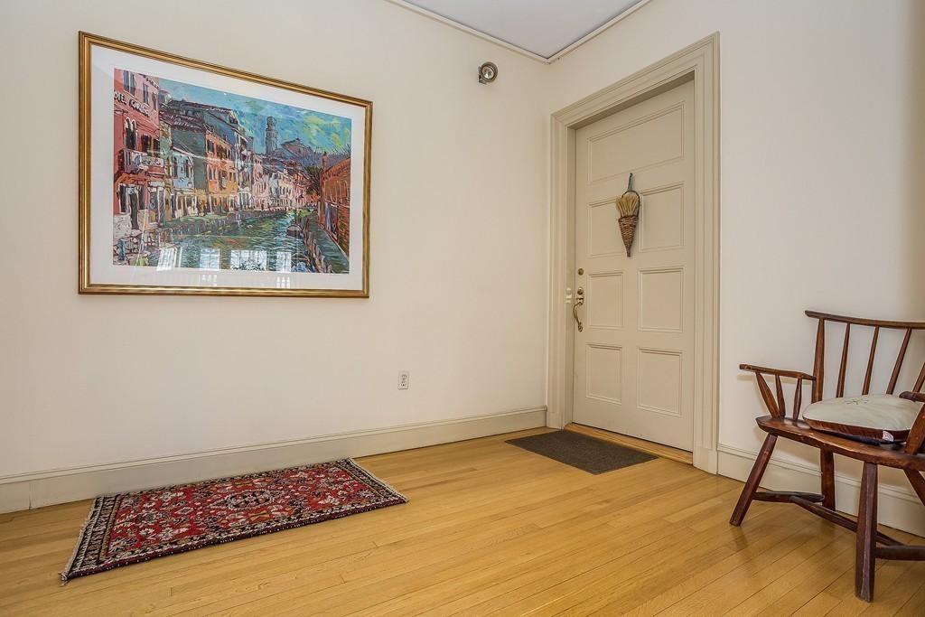 100 Pond Street, Unit 6 Boston, MA 02130 - Photo 25 of 29 a view of a room with wooden floor and a workspace