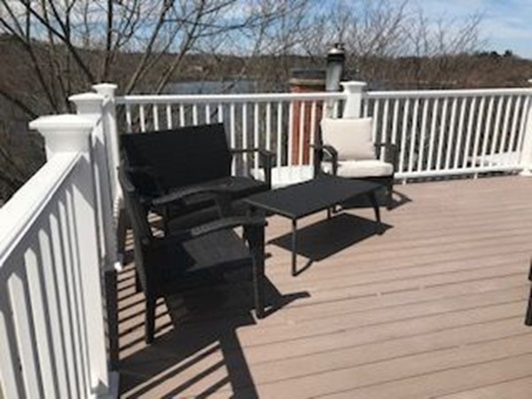 100 Pond Street, Unit 6 Boston, MA 02130 - Photo 28 of 29 a roof deck with a table and chairs