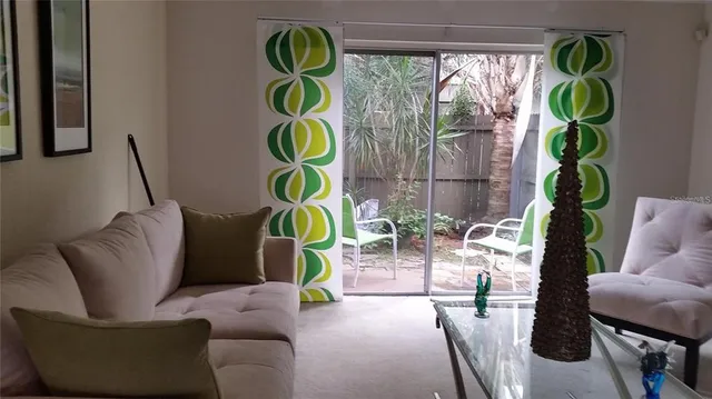 a living room with furniture and a sign
