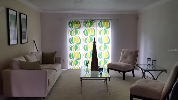a living room with furniture and a window