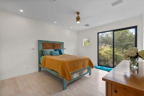 a bathroom with a granite countertop sink mirror and a shower