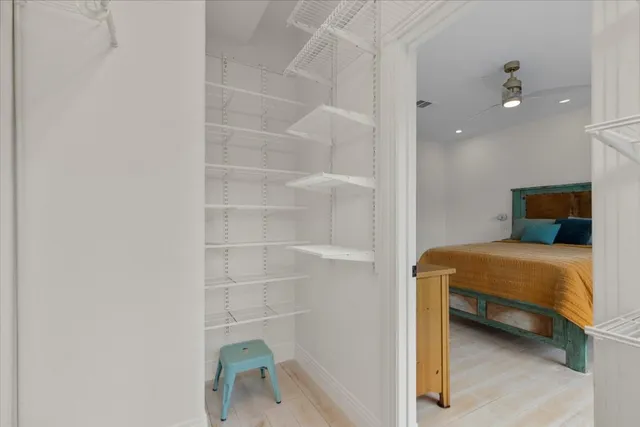 a bedroom with a bed and a dresser