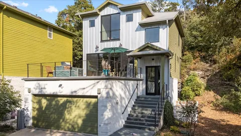 an aerial view of house with yard