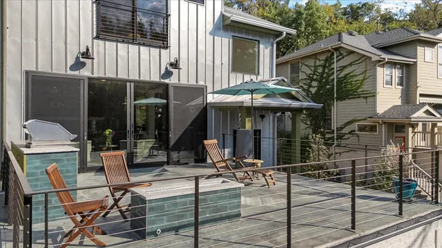 a view of a house with backyard porch and sitting area