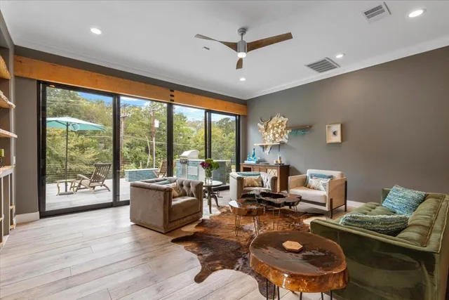 a living room with furniture and a large window