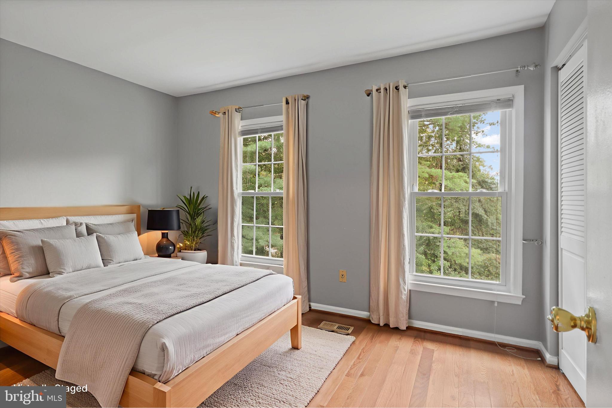 8564 Springfield Oaks Drive Springfield, VA 22153 - Photo 18 of 28 a bedroom with a large bed and a window