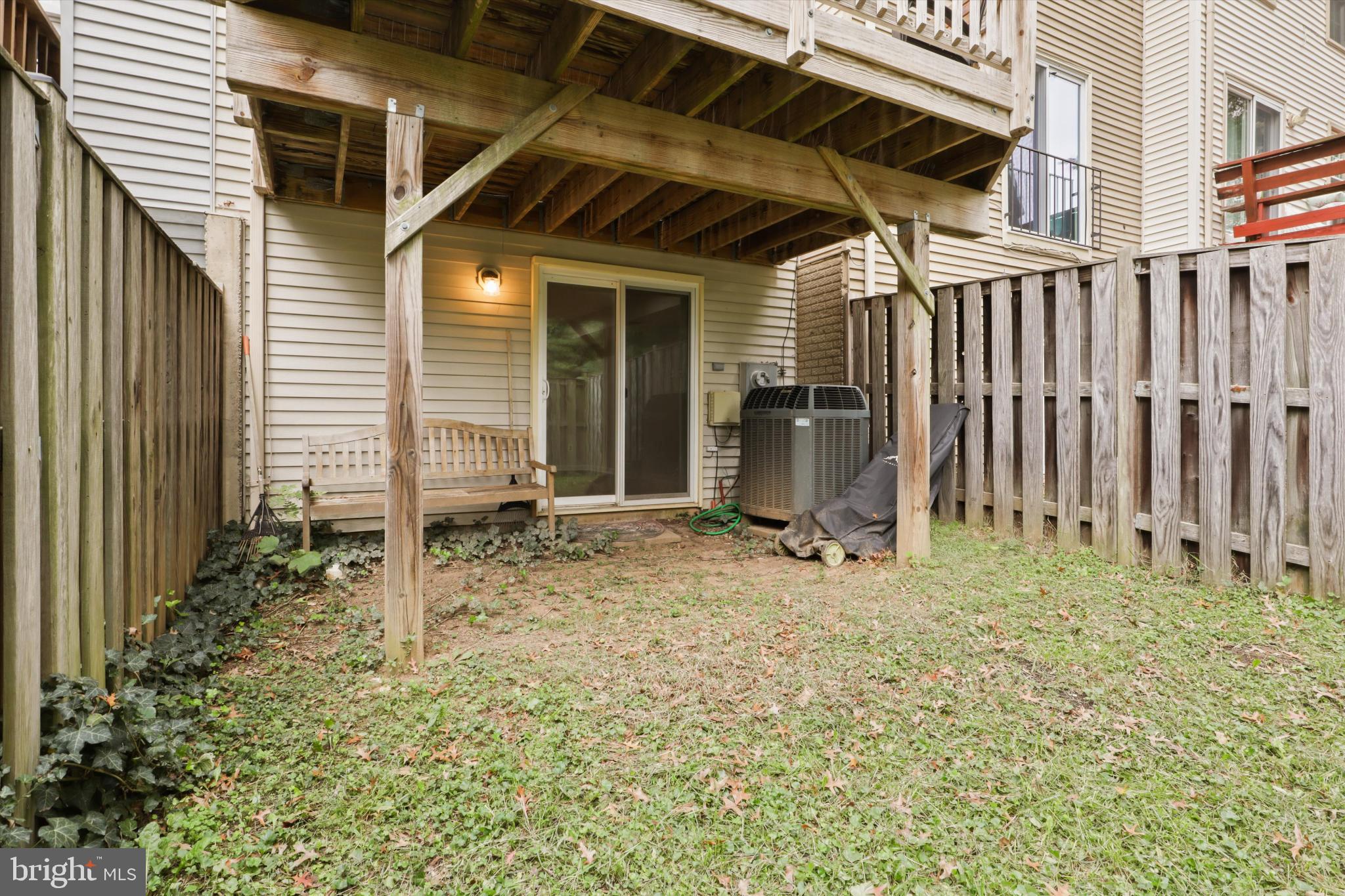 8564 Springfield Oaks Drive Springfield, VA 22153 - Photo 24 of 28 a backyard of a house with table and chairs