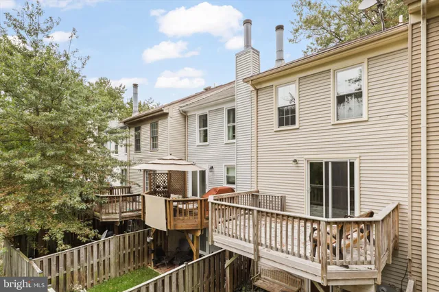 a view of a house with wooden deck