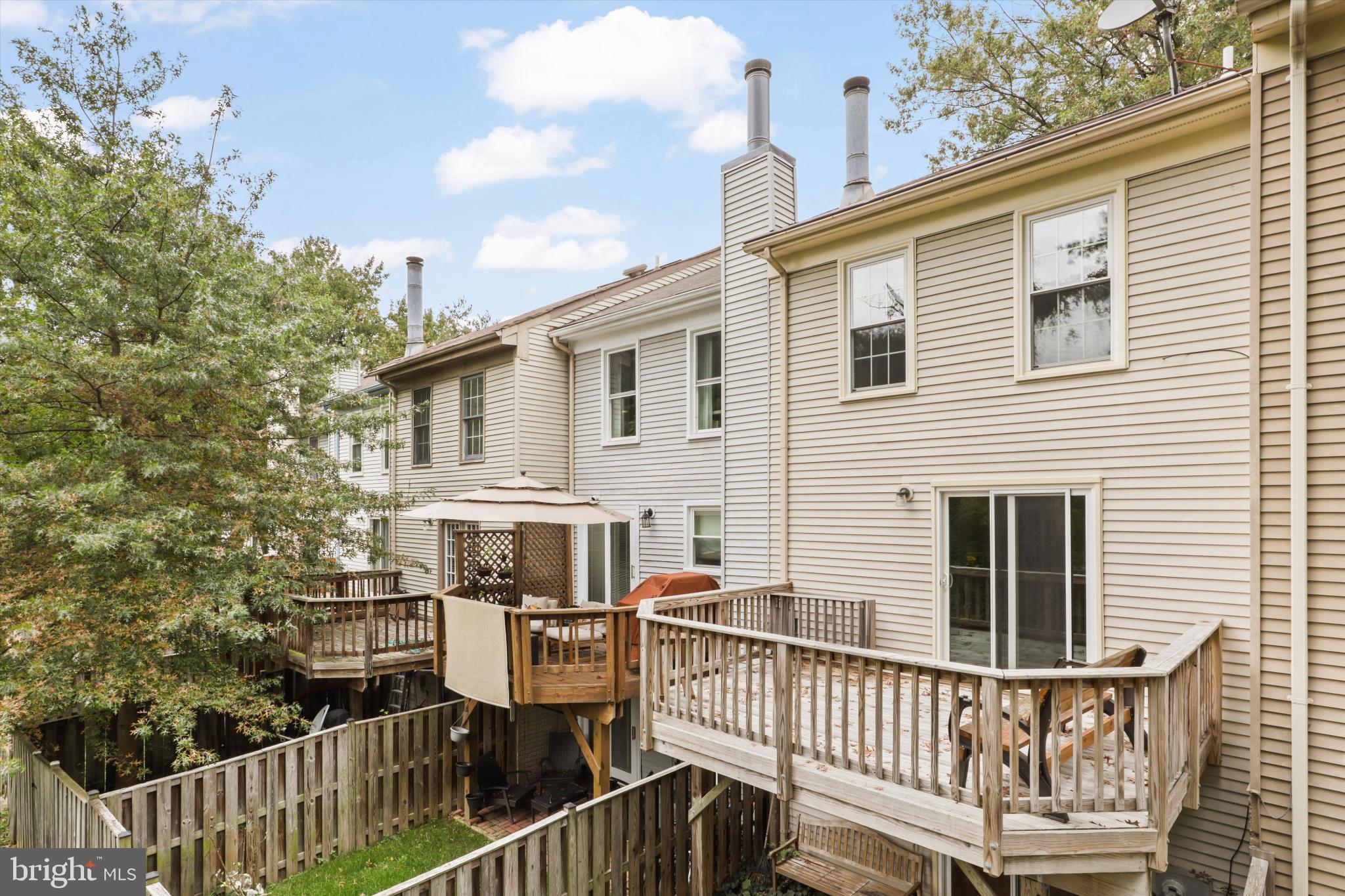 8564 Springfield Oaks Drive Springfield, VA 22153 - Photo 25 of 28 a view of a house with wooden deck