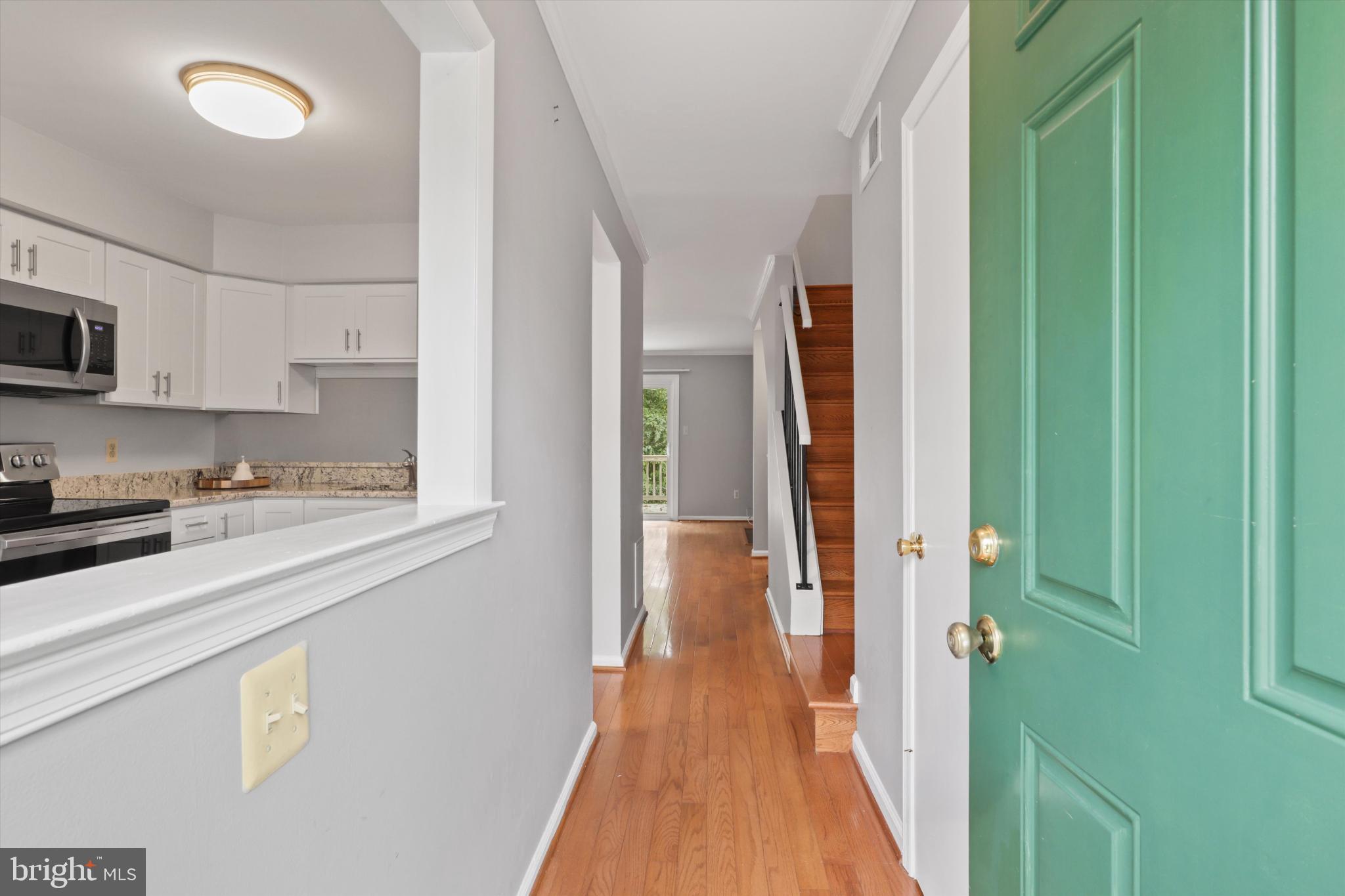 8564 Springfield Oaks Drive Springfield, VA 22153 - Photo 3 of 28 a view of a kitchen from the hallway