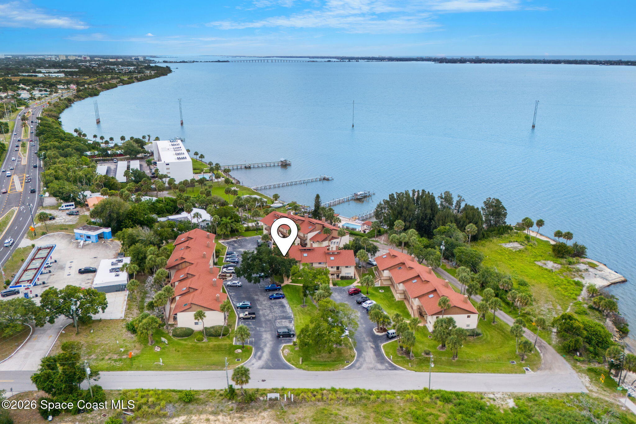 3121 Kirkland Road Northeast Palm Bay, FL 32905 - Photo 44 of 52 an aerial view of a house with a garden and lake view