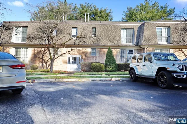 a view of a cars in front of a house
