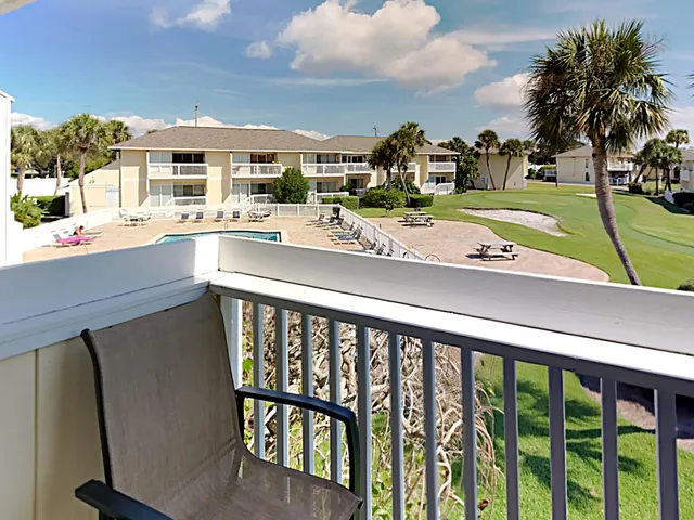 a view of swimming pool from a balcony
