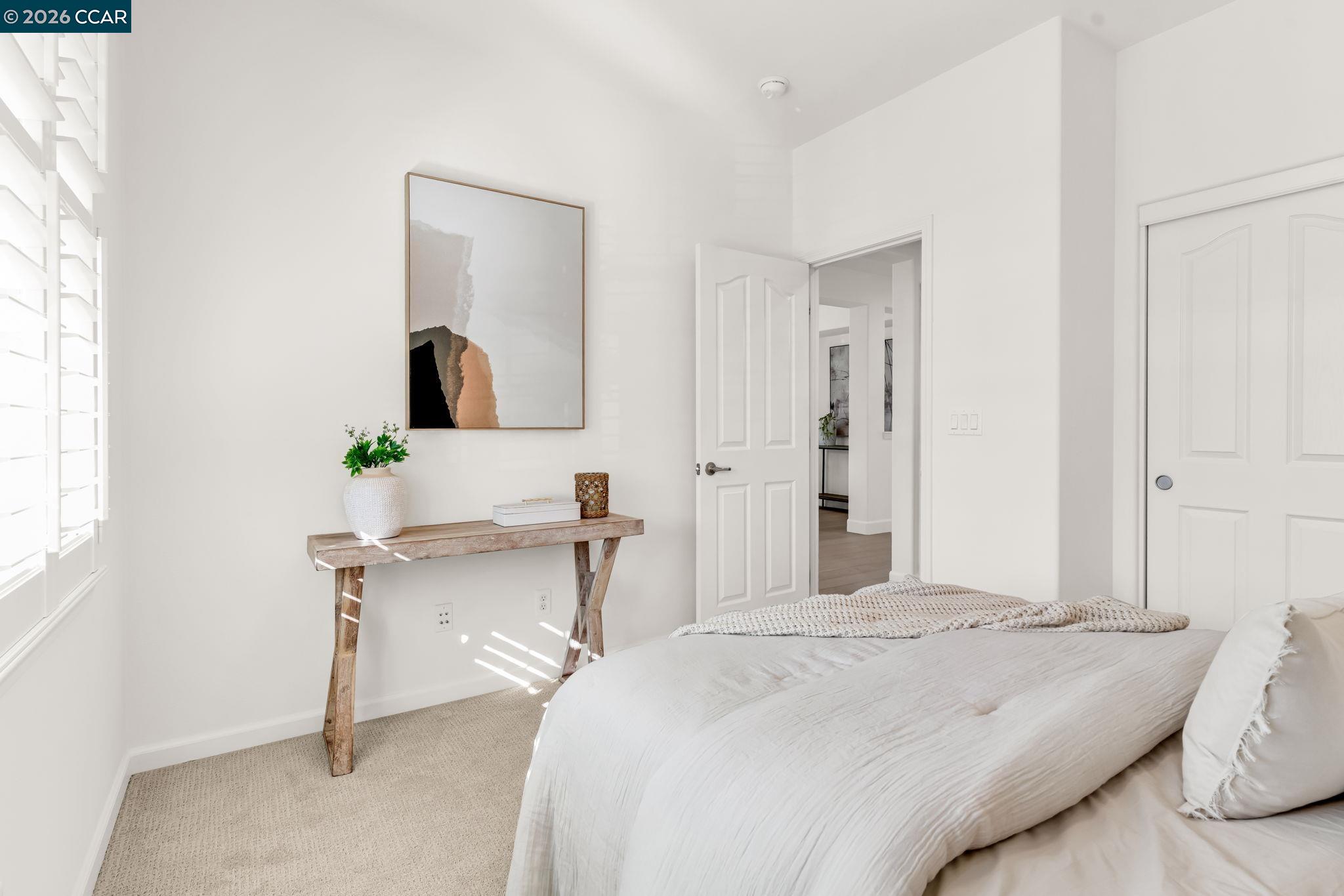 116 Spalding Court San Ramon, CA 94582 - Photo 25 of 59 a bedroom with a bed and a chair in it