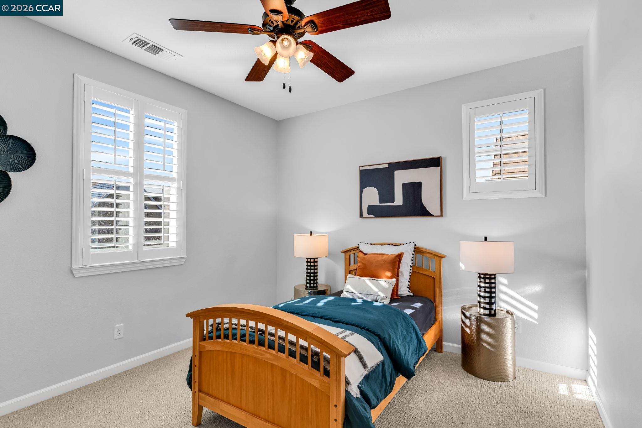 116 Spalding Court San Ramon, CA 94582 - Photo 40 of 59 a bedroom with a bed and wooden floor