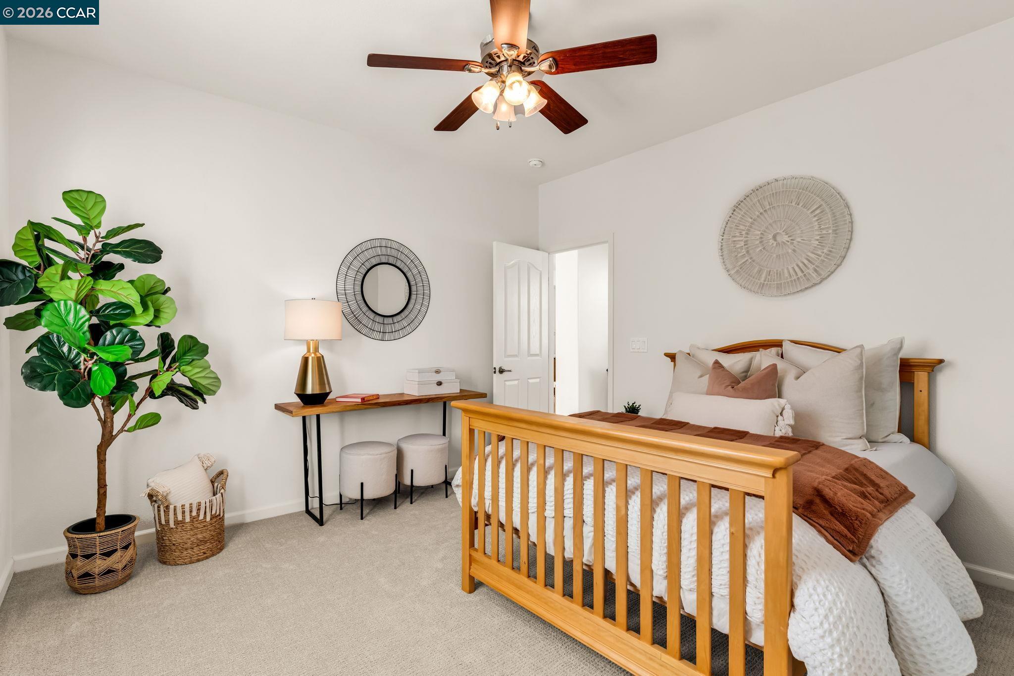 116 Spalding Court San Ramon, CA 94582 - Photo 45 of 59 a bedroom with bed and a potted plant
