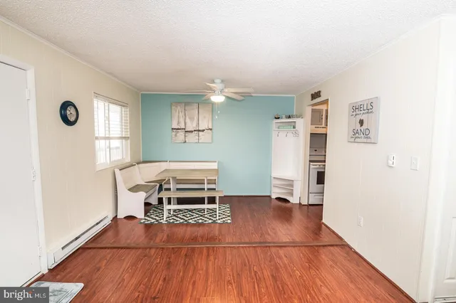 a living room with a furniture and a window