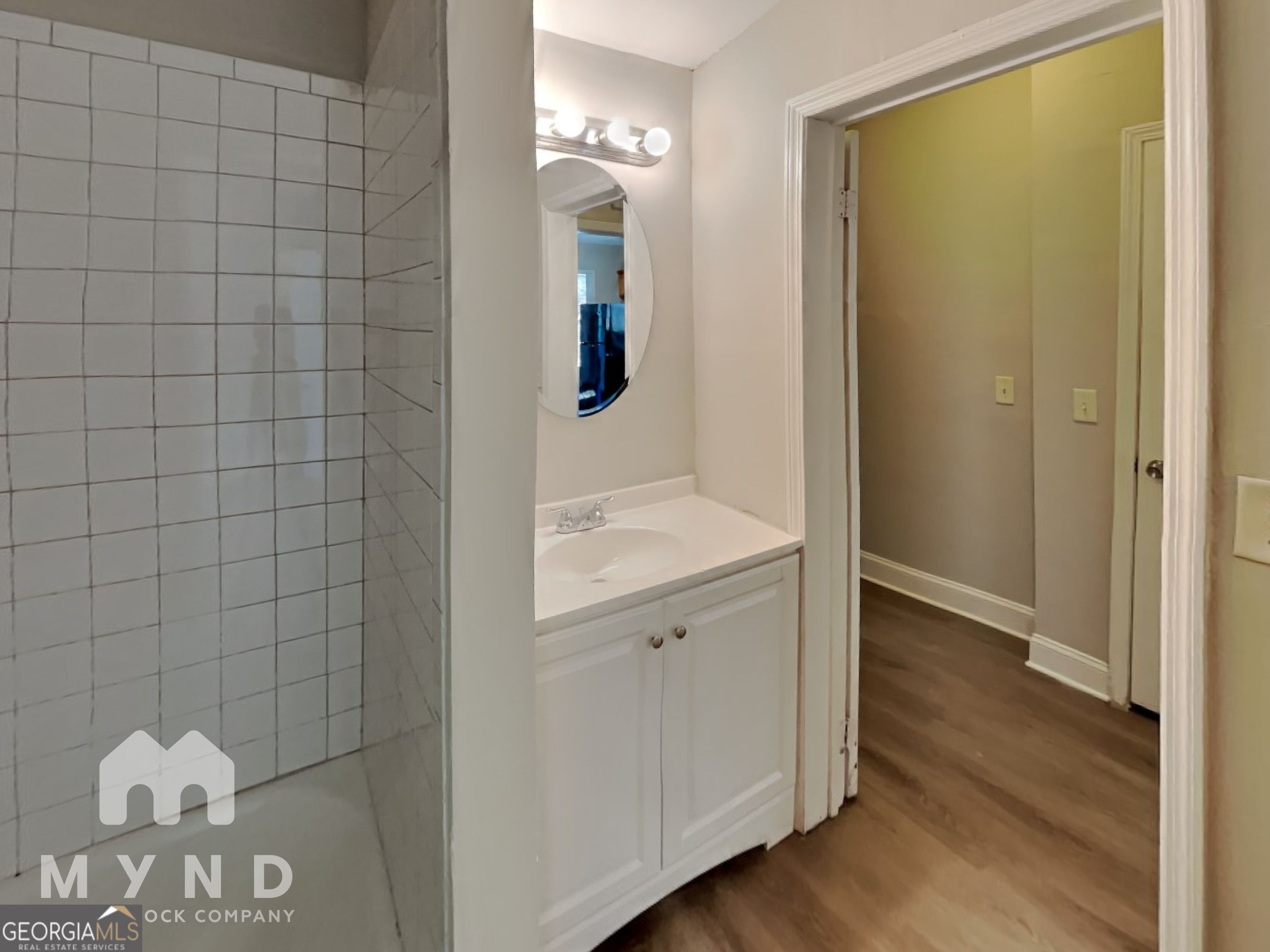 1708 Evans Drive Southwest Atlanta, GA 30310 - Photo 11 of 14 a bathroom with a sink mirror and vanity