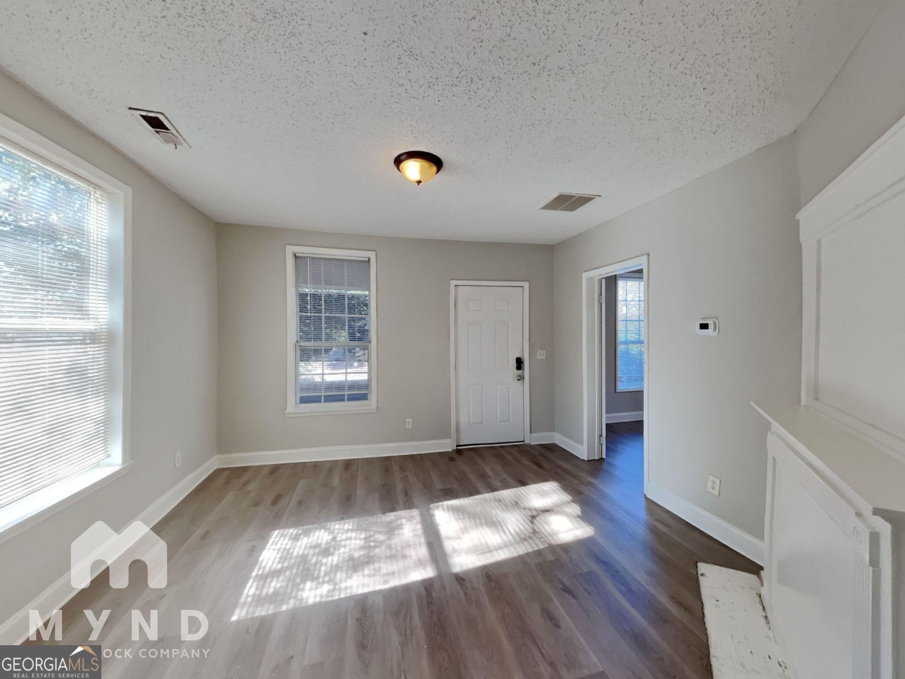 1708 Evans Drive Southwest Atlanta, GA 30310 - Photo 3 of 14 a view of wooden floor in an empty room with a window