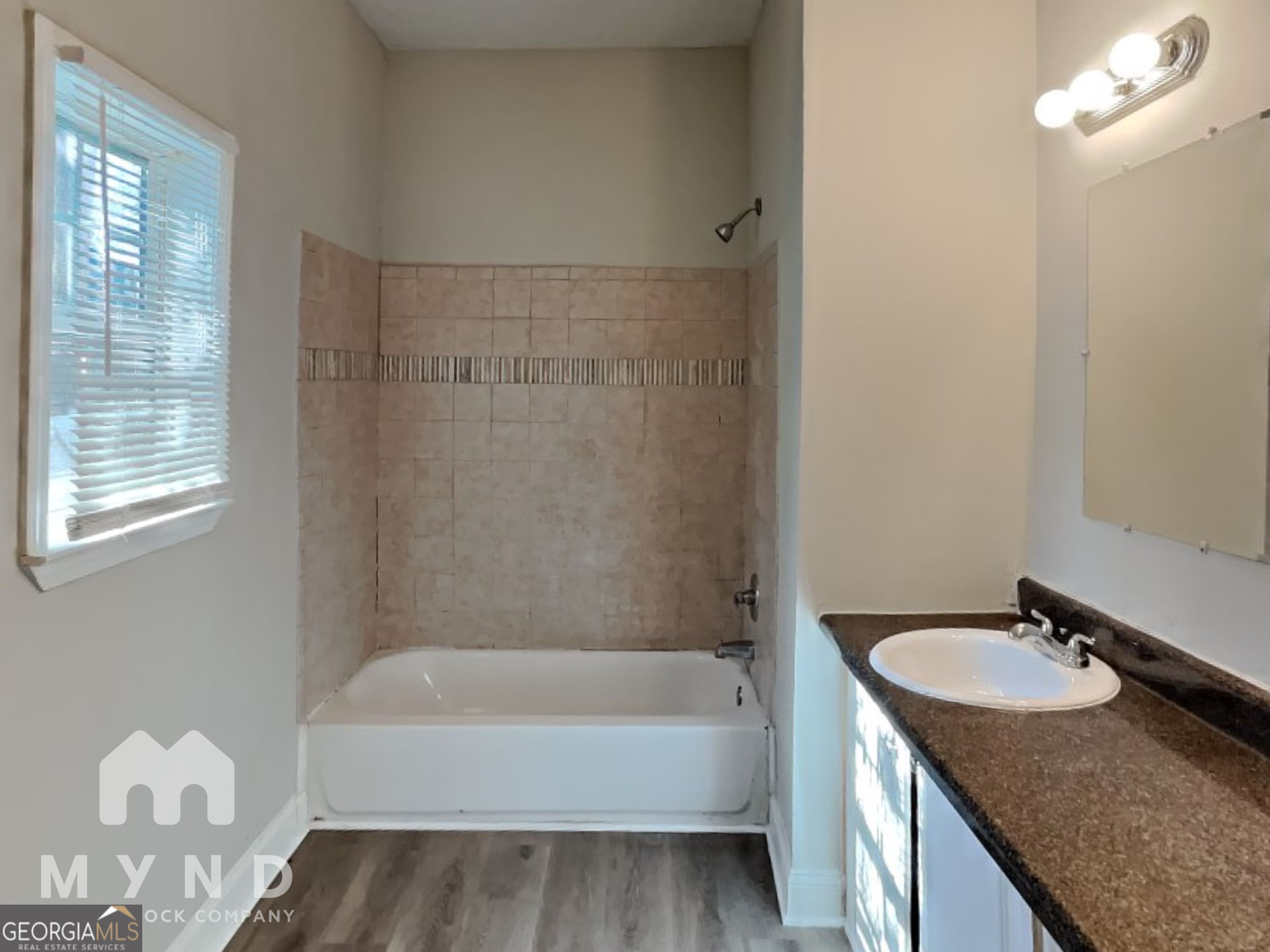 1708 Evans Drive Southwest Atlanta, GA 30310 - Photo 8 of 14 a bathroom with a granite countertop sink and a mirror
