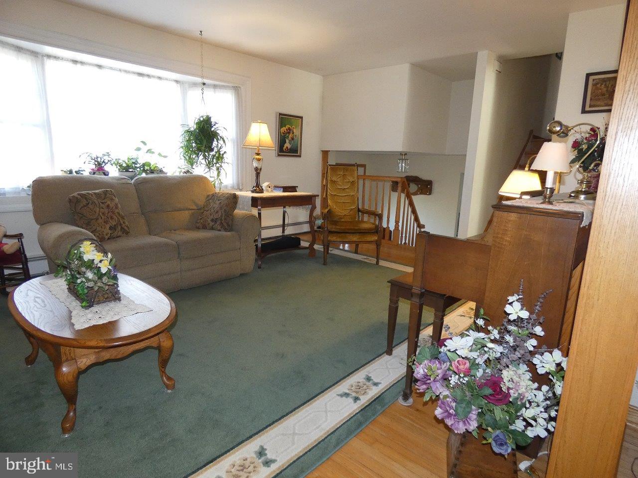 911 Lavera Road Warminster, PA 18974 - Photo 3 of 33 Spacious living room boasts a large bay window.