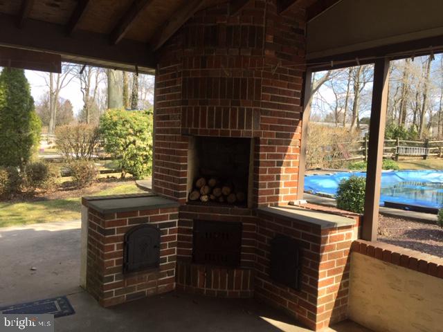 911 Lavera Road Warminster, PA 18974 - Photo 33 of 33 Custom brick fireplace/grill on the covered patio.