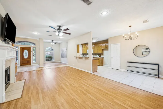 a view of an empty room with a kitchen