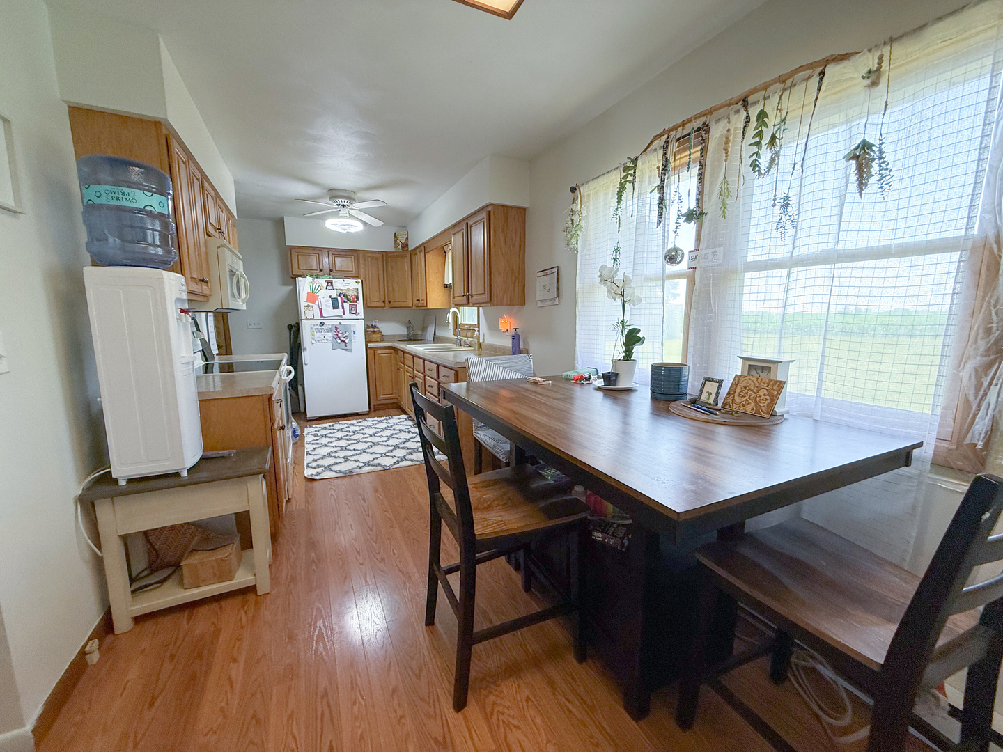 31535 East Thome Road Rock Falls, IL 61071 - Photo 14 of 31 a view of a dining room with furniture window and wooden floor