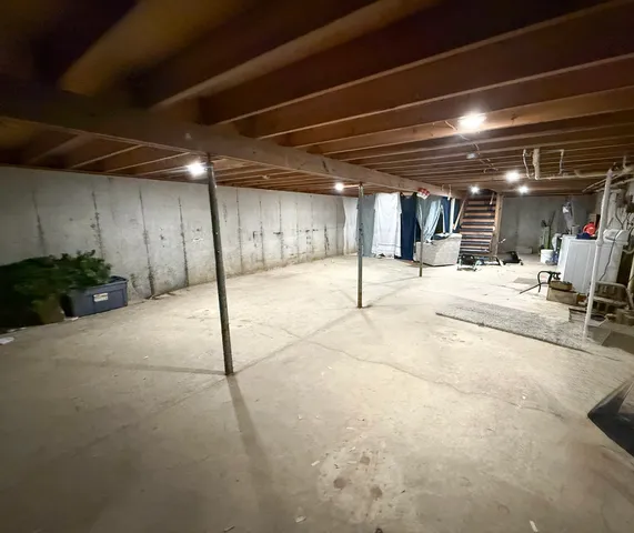 a view of a hall with wooden floor