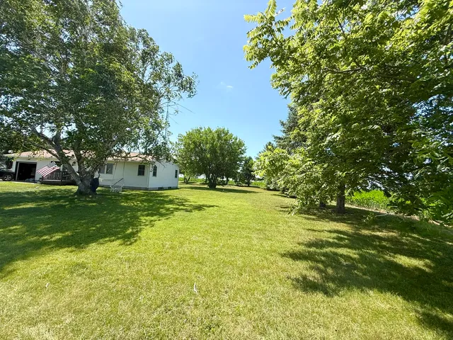a view of yard with swimming pool