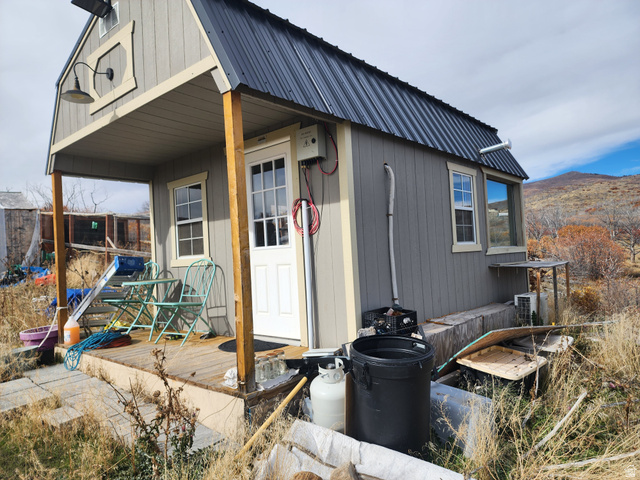 137 East Canyon Hollow Road, Unit 137 Fairview, UT 84629 - Photo 1 of 25 View of side of home with a metal roof, a mountain view, and a porch