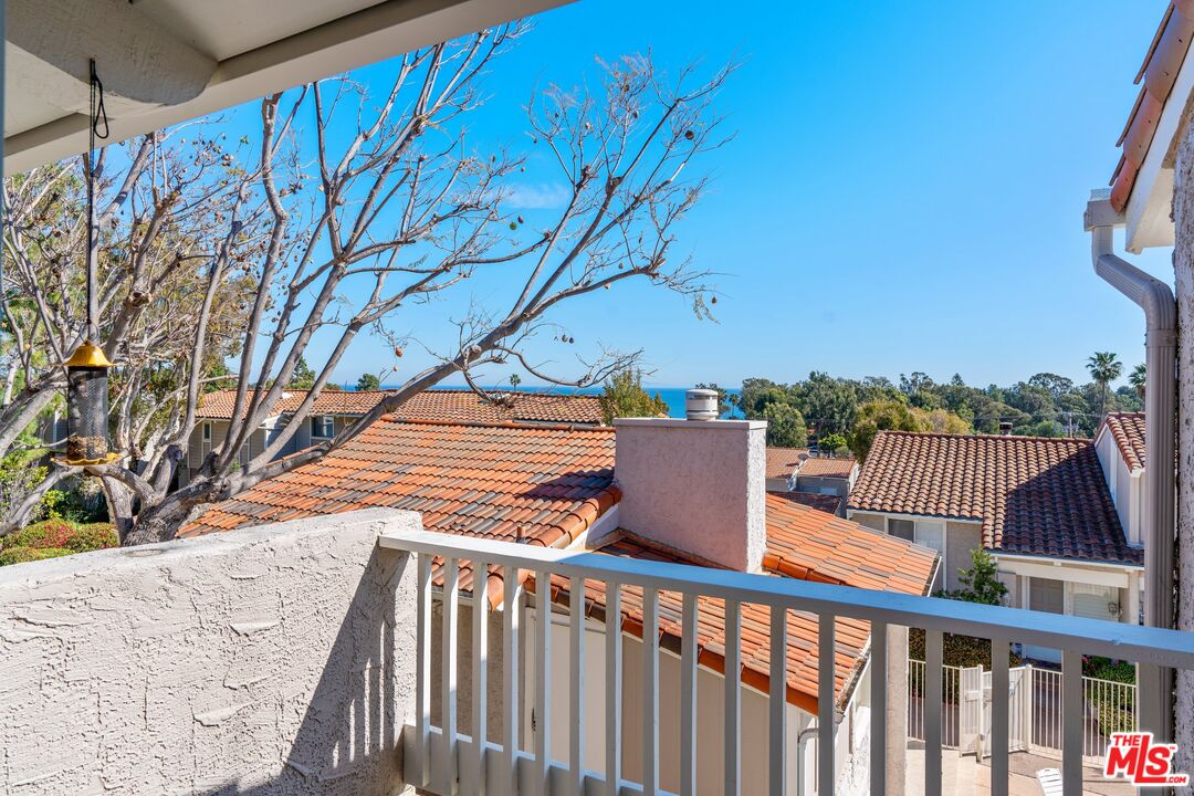 28244 Rey De Copas Lane Malibu, CA 90265 - Photo 15 of 31 a balcony view with a yard