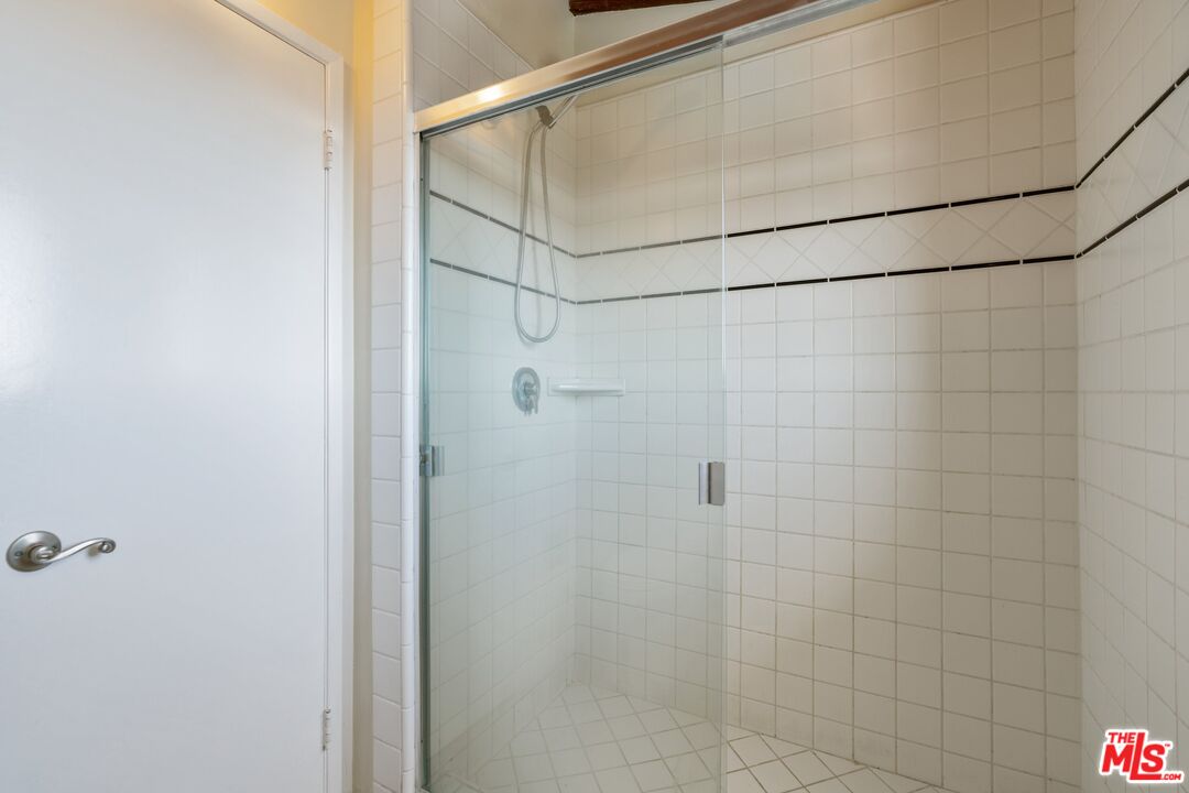 28244 Rey De Copas Lane Malibu, CA 90265 - Photo 17 of 31 a bathroom with a shower