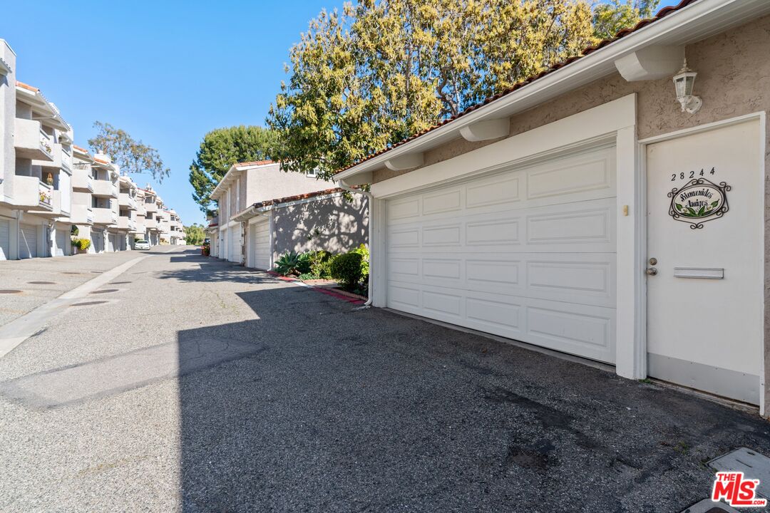 28244 Rey De Copas Lane Malibu, CA 90265 - Photo 25 of 31 a view of a street with big house