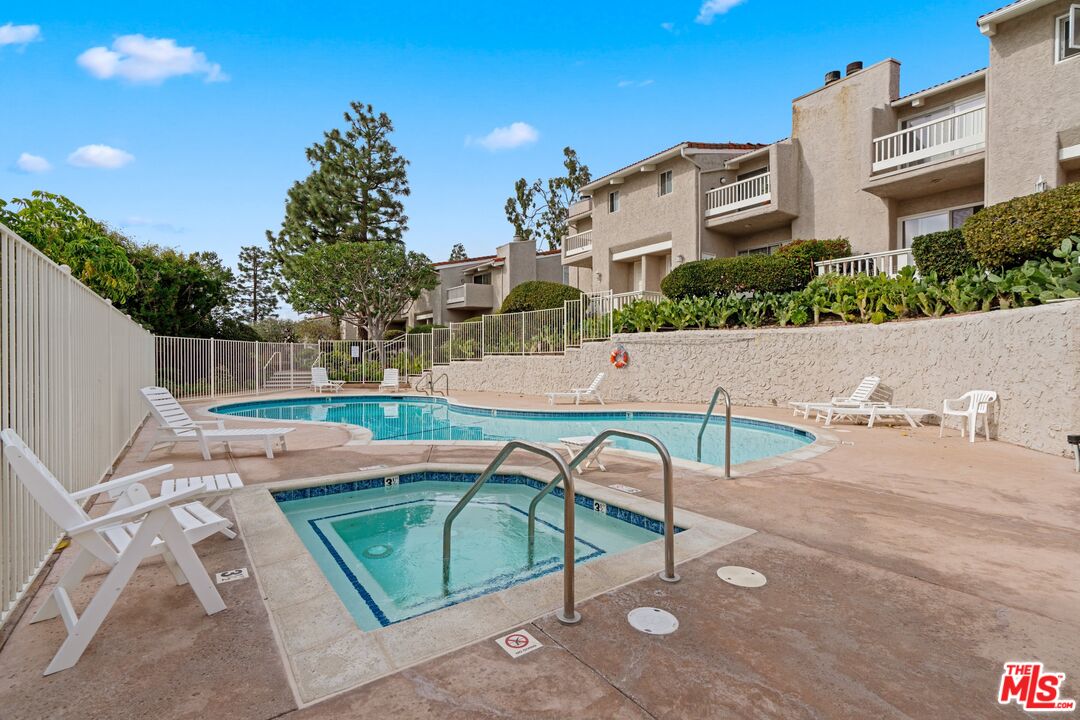 28244 Rey De Copas Lane Malibu, CA 90265 - Photo 28 of 31 a view of a patio with a table and chairs