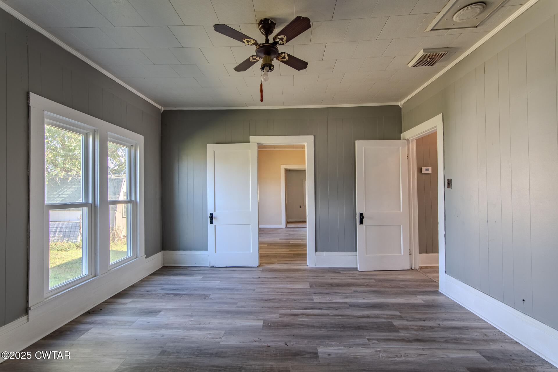 101 North Front Street Kenton, TN 38233 - Photo 13 of 30 a view of a livingroom with a chandelier fan and windows